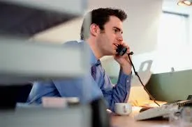 Agent making calls at his desk